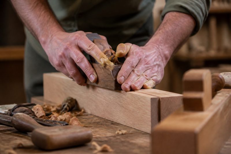 Carpenter working with wood
